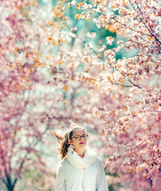 Woman amongst flowering trees in Finland - the cost of employing in Finland